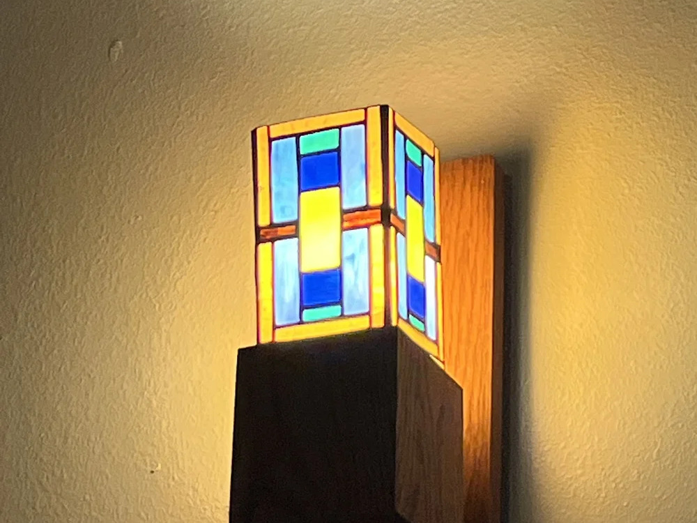 Stained glass wall sconce with wood base